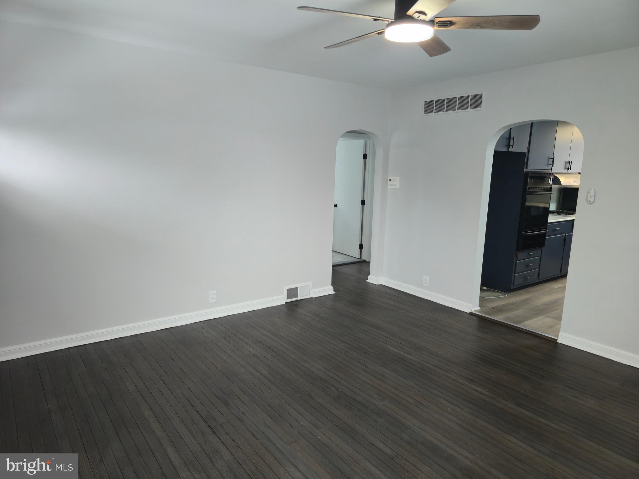212 New Albany Road Moorestown, NJ 08057 - Photo 4 of 26 an empty room with wooden floor and ceiling fan