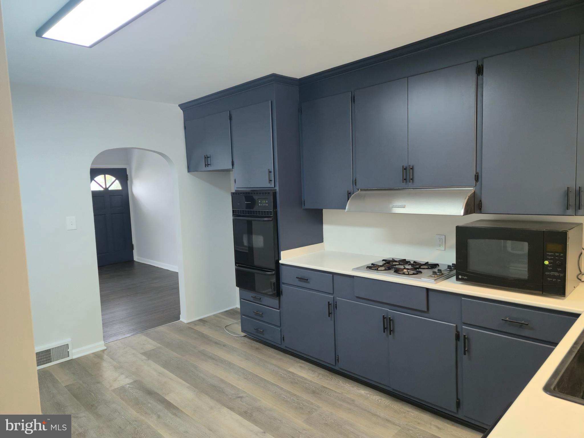 212 New Albany Road Moorestown, NJ 08057 - Photo 5 of 26 a kitchen with cabinets and a fireplace