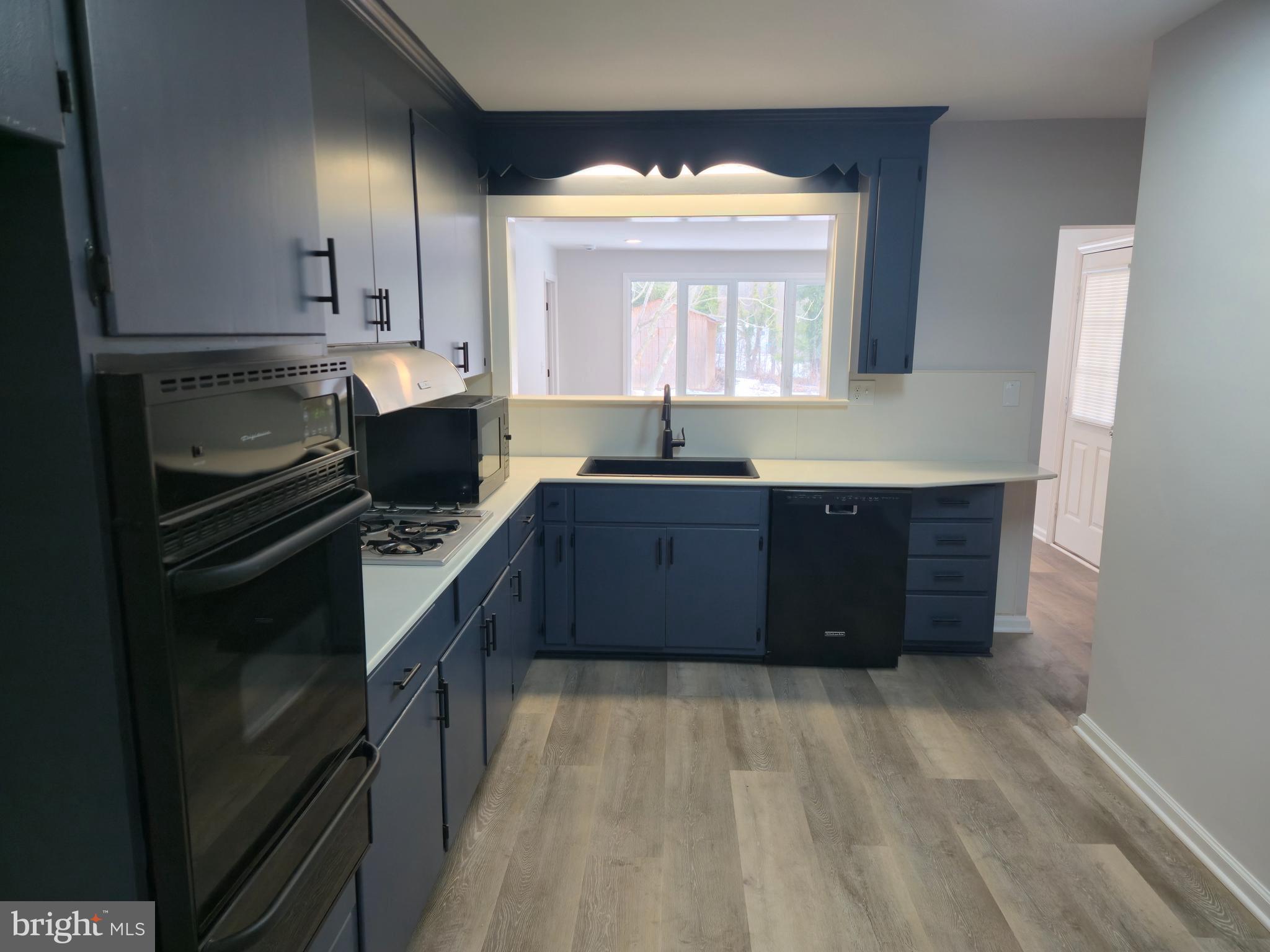 212 New Albany Road Moorestown, NJ 08057 - Photo 6 of 26 a kitchen with stainless steel appliances granite countertop a stove a sink and a refrigerator