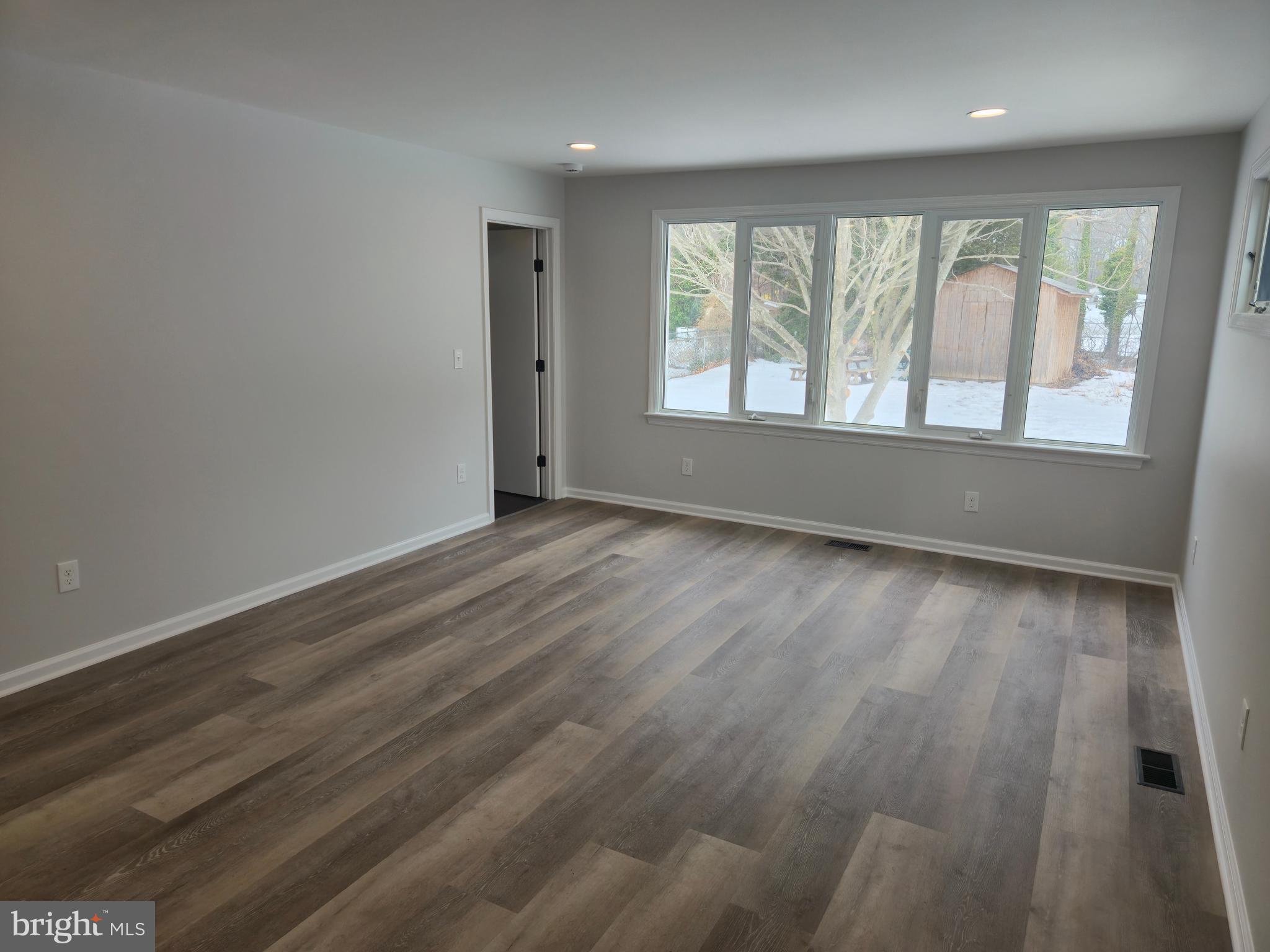 212 New Albany Road Moorestown, NJ 08057 - Photo 8 of 26 wooden floor in an empty room with a window