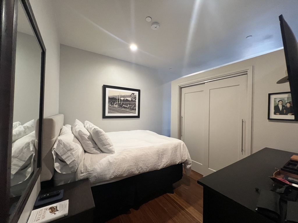 33 3rd Avenue, Unit 313 Boston, MA 02129 - Photo 11 of 18 a bedroom with a bed and a desk