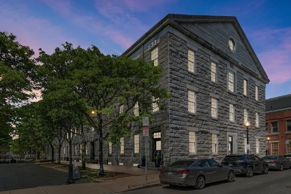 a car parked in front of a building