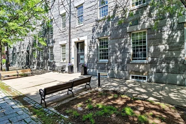 a bench sitting in front of a building