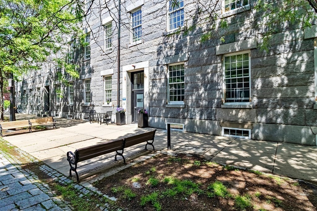 33 3rd Avenue, Unit 313 Boston, MA 02129 - Photo 2 of 18 a bench sitting in front of a building