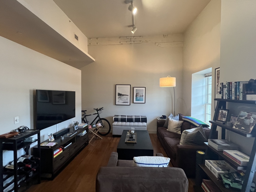 33 3rd Avenue, Unit 313 Boston, MA 02129 - Photo 6 of 18 a living room with furniture and a flat screen tv