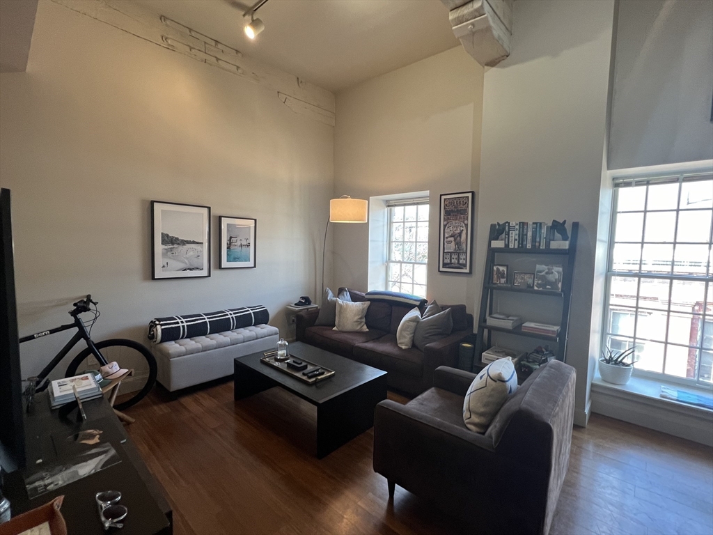 33 3rd Avenue, Unit 313 Boston, MA 02129 - Photo 8 of 18 a living room with furniture and a window