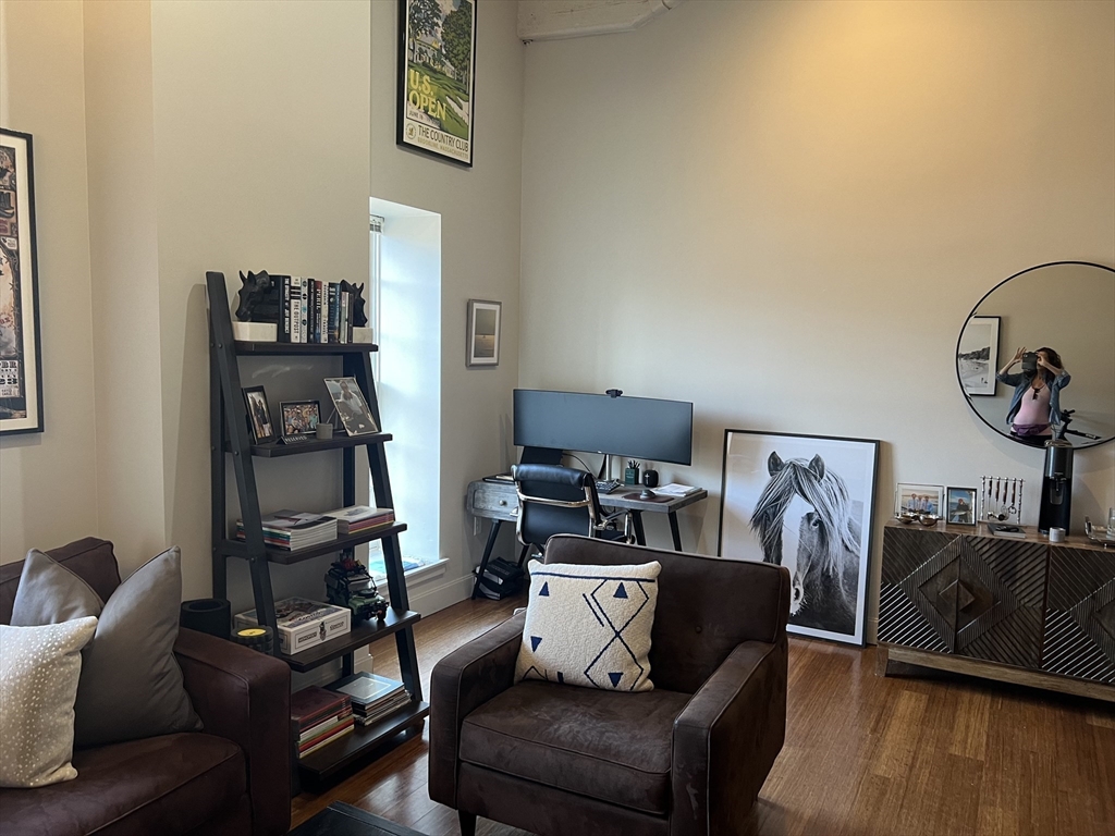 33 3rd Avenue, Unit 313 Boston, MA 02129 - Photo 10 of 18 a living room with furniture and a flat screen tv