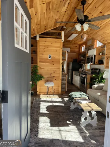 a building outdoor space with patio furniture and potted plants