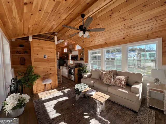 a living room with furniture a fireplace and a table