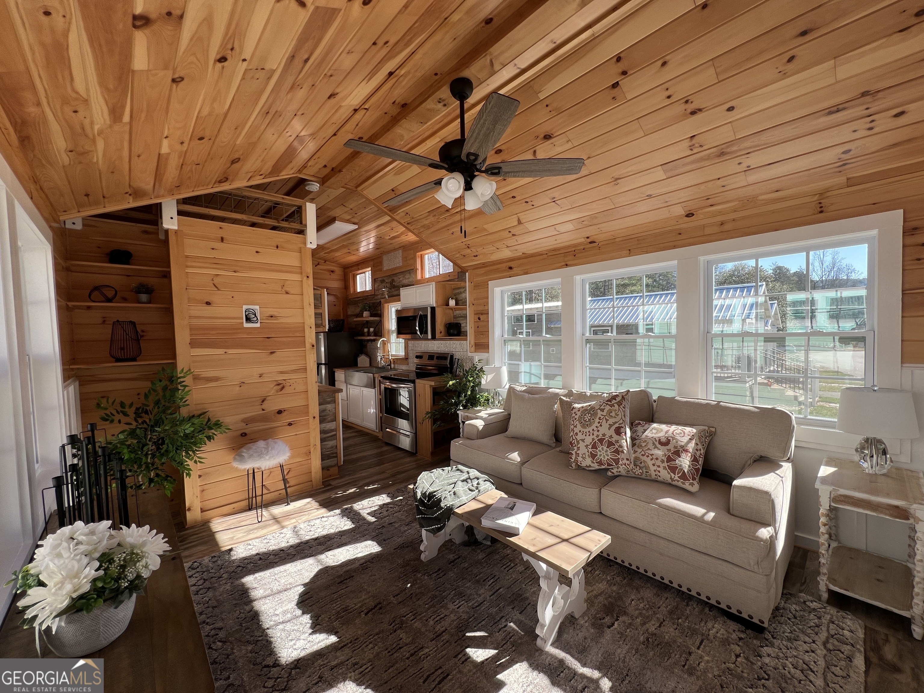 4960 Laurel Lodge Road, Unit 41 Clarkesville, GA 30523 - Photo 13 of 46 a living room with furniture a fireplace and a table