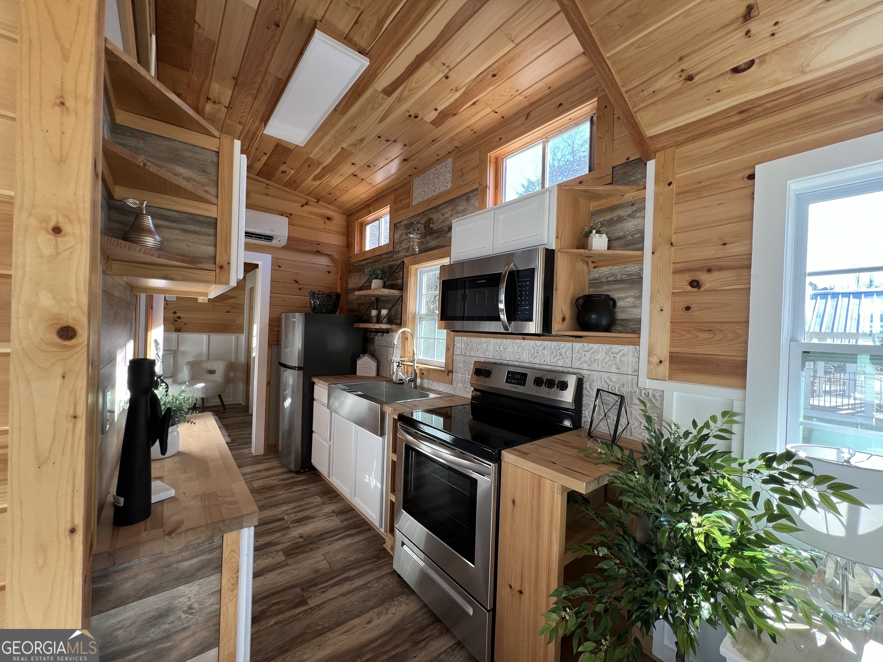 4960 Laurel Lodge Road, Unit 41 Clarkesville, GA 30523 - Photo 16 of 46 a kitchen with stainless steel appliances a stove a microwave and a refrigerator