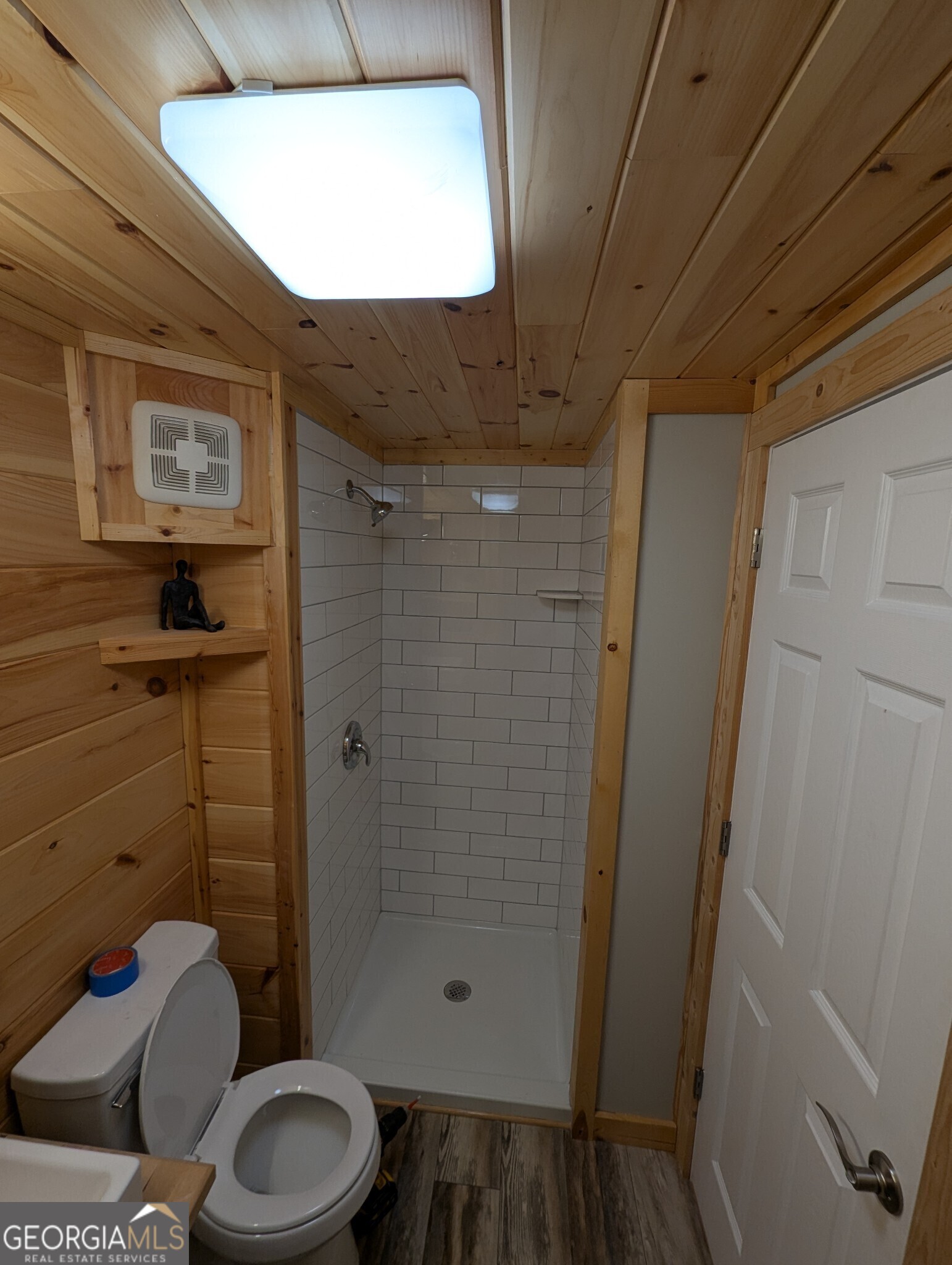 4960 Laurel Lodge Road, Unit 41 Clarkesville, GA 30523 - Photo 19 of 46 a bathroom with a toilet and a shower