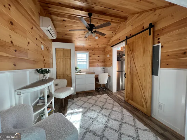 a bathroom with a sink toilet a mirror and shower
