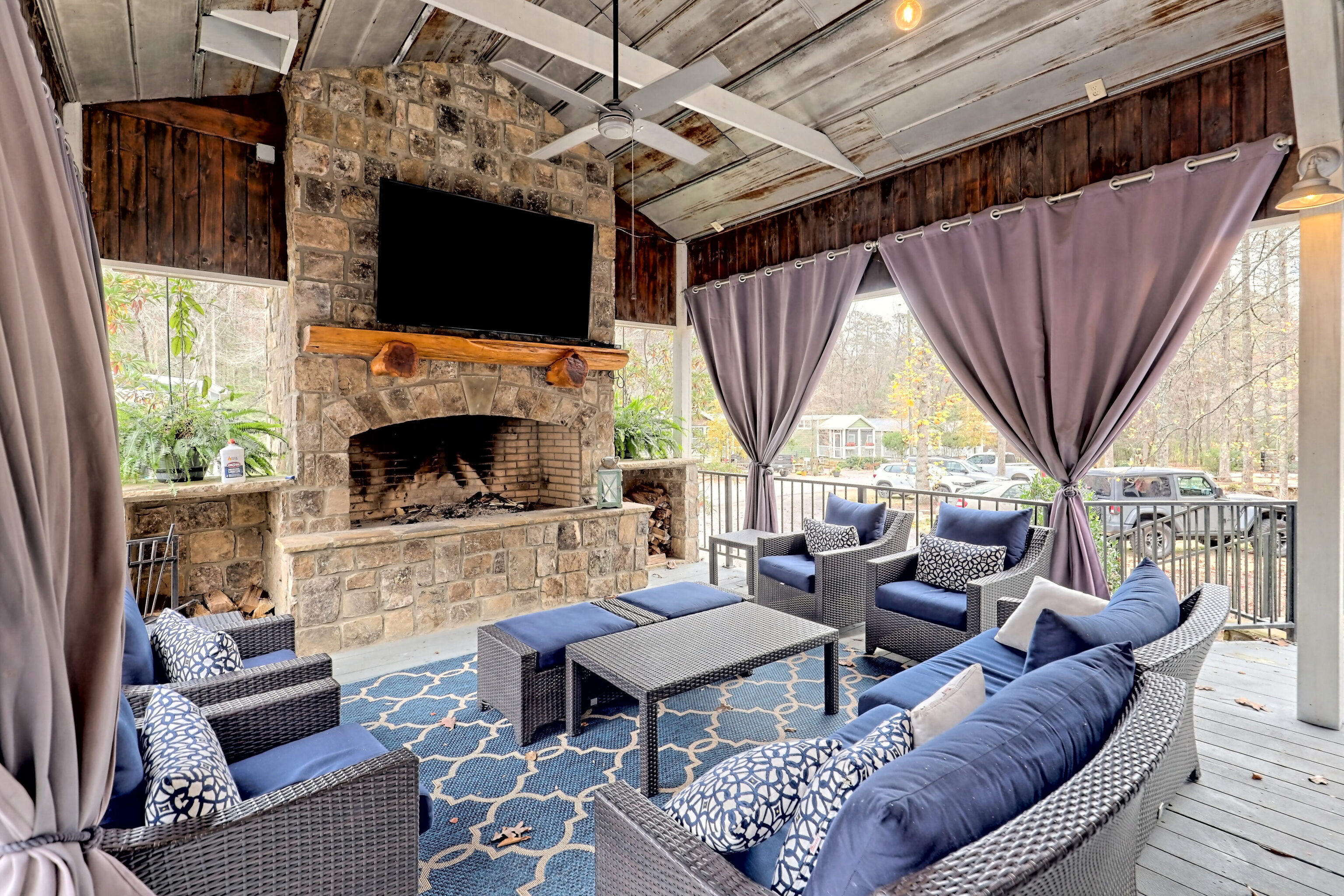 4960 Laurel Lodge Road, Unit 41 Clarkesville, GA 30523 - Photo 38 of 46 a living room with furniture a flat screen tv and a fireplace