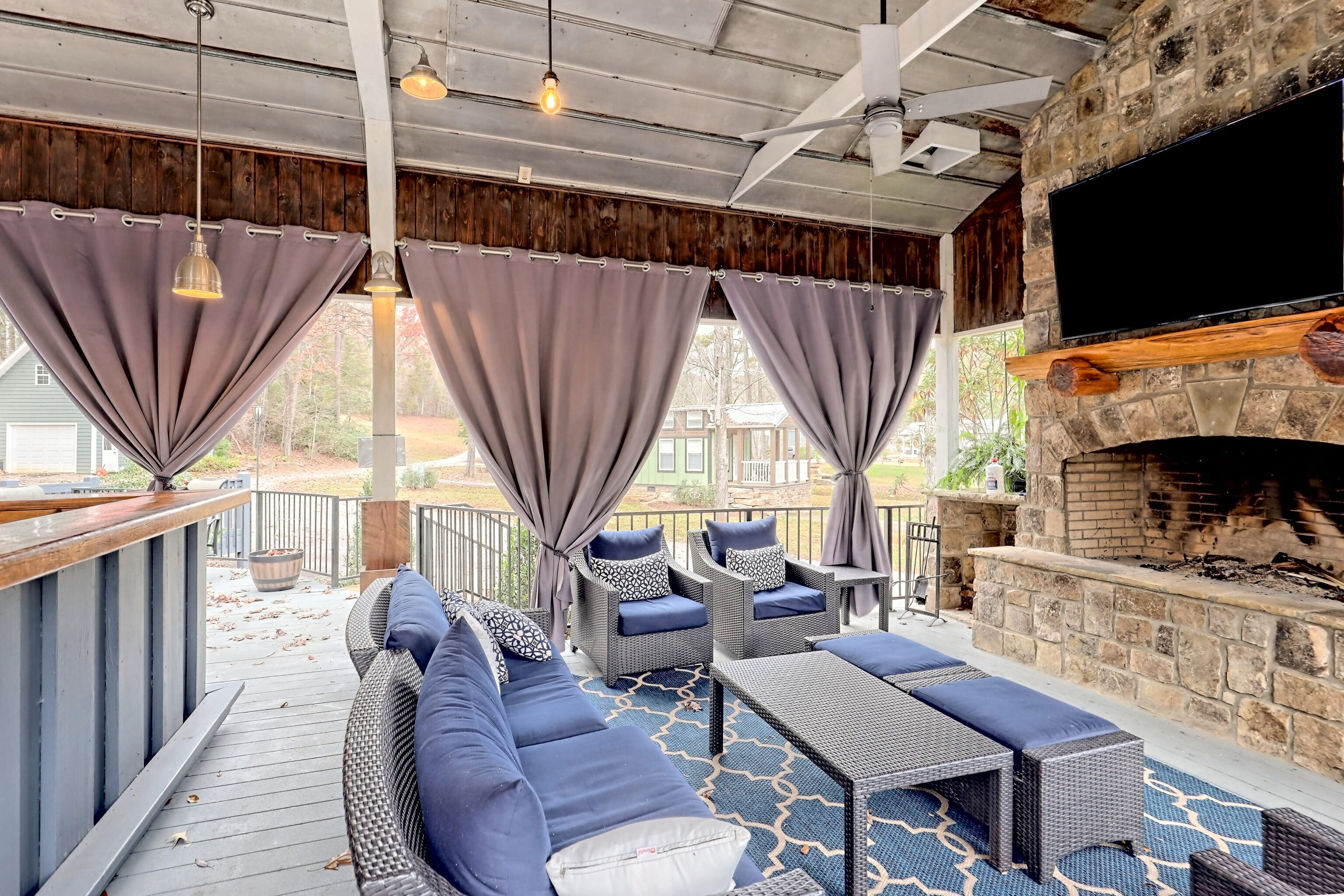 4960 Laurel Lodge Road, Unit 41 Clarkesville, GA 30523 - Photo 40 of 46 a living room with furniture a fireplace and a flat screen tv