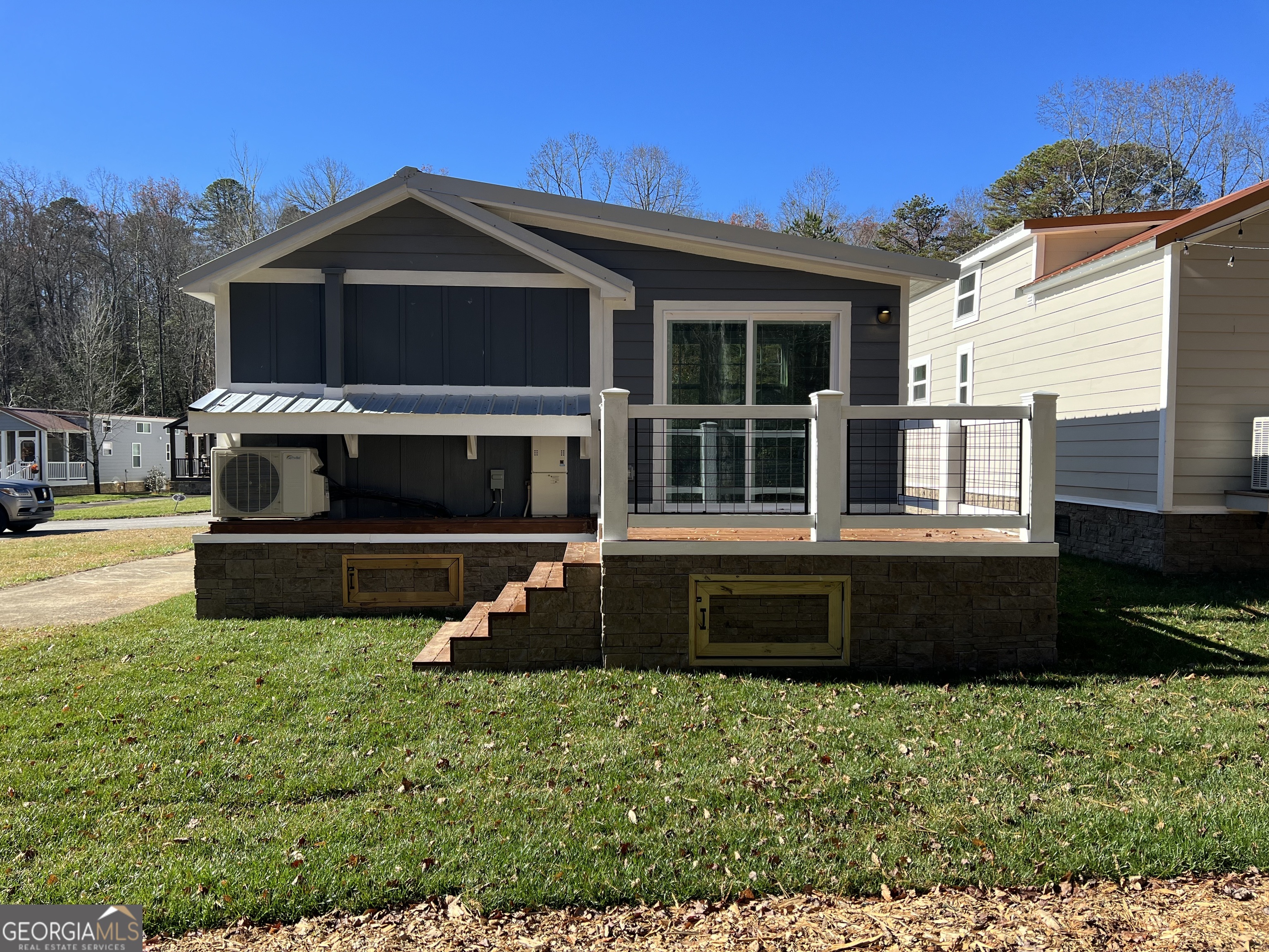4960 Laurel Lodge Road, Unit 41 Clarkesville, GA 30523 - Photo 6 of 46 a front view of a house with a yard