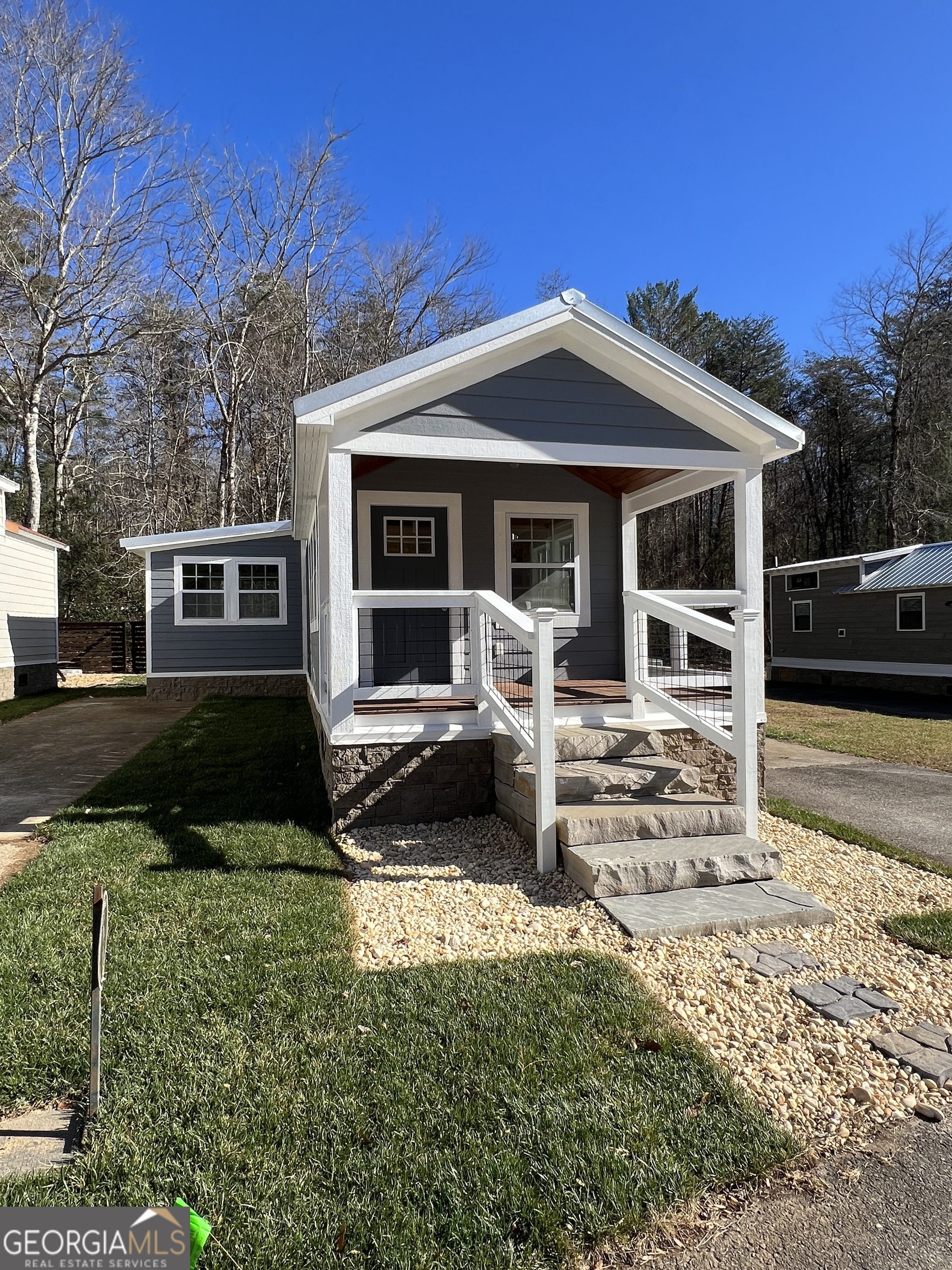 4960 Laurel Lodge Road, Unit 41 Clarkesville, GA 30523 - Photo 10 of 46 front view of a house with a yard