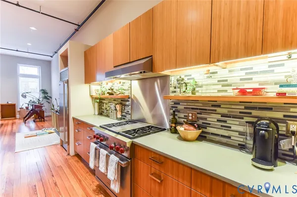 a kitchen with appliances cabinets and a sink