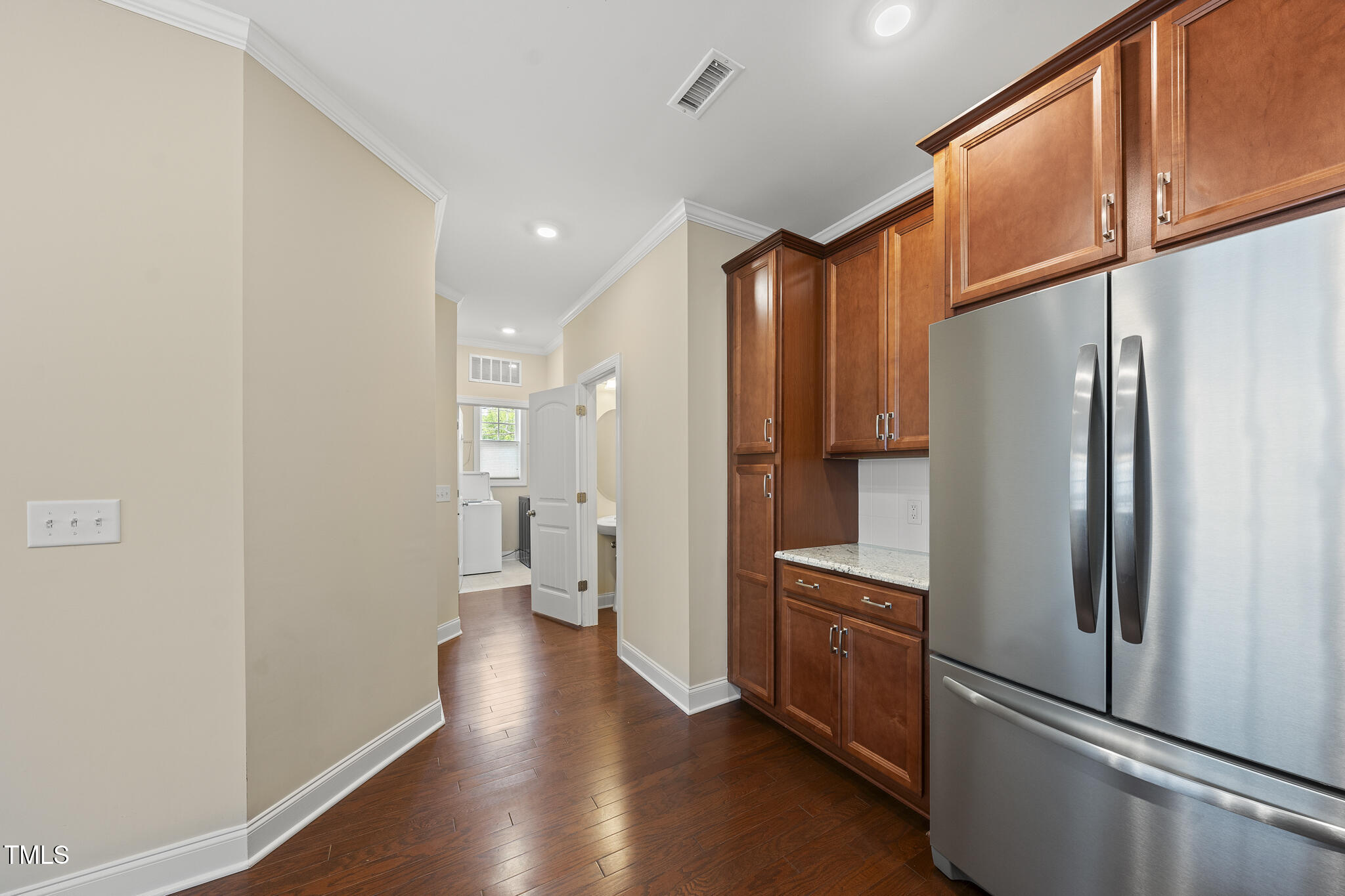 111 Wards Ridge Drive Cary, NC 27513 - Photo 10 of 46 a kitchen with stainless steel appliances a refrigerator and wooden floor
