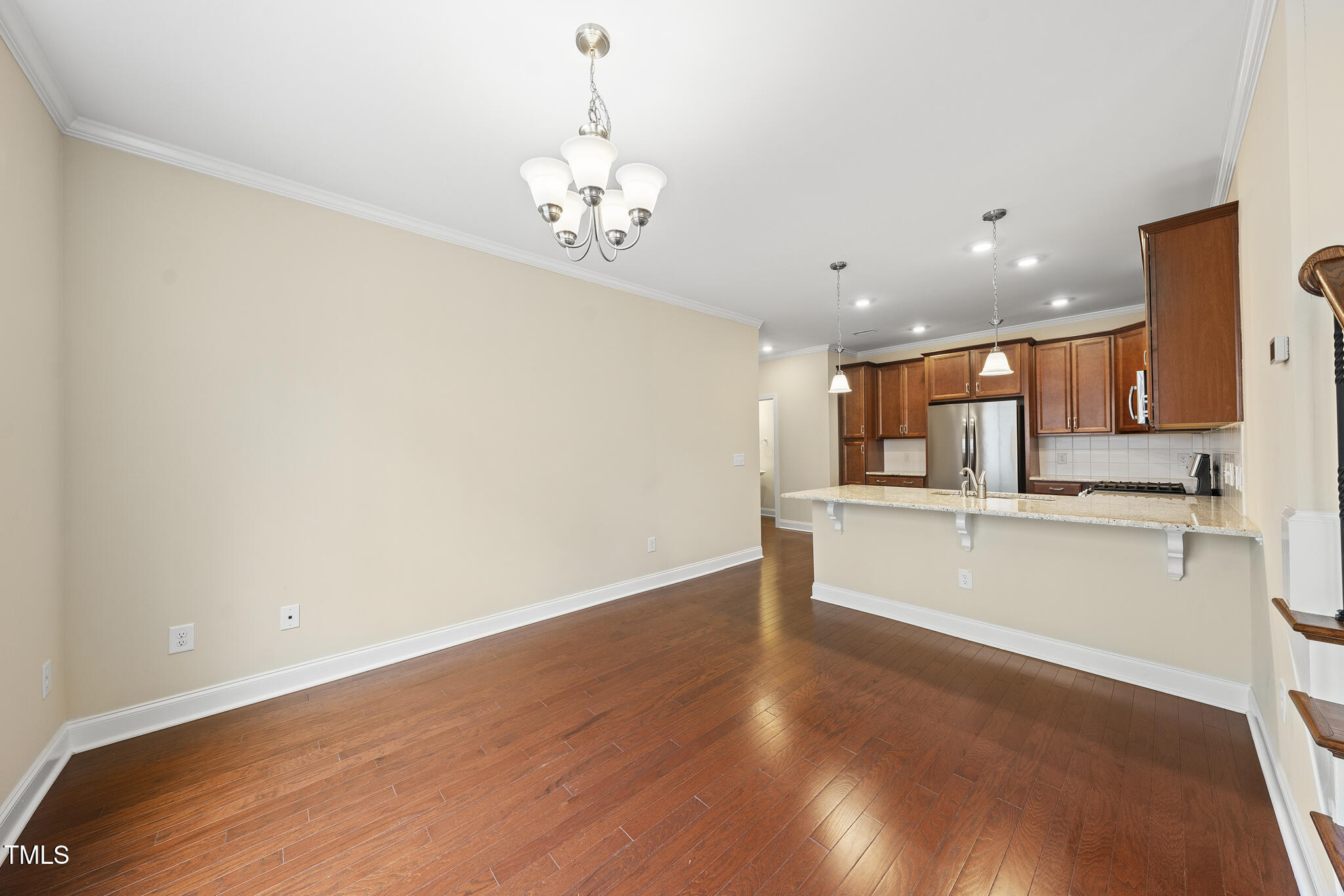 111 Wards Ridge Drive Cary, NC 27513 - Photo 13 of 46 a view of a kitchen with a sink and dishwasher with wooden floor