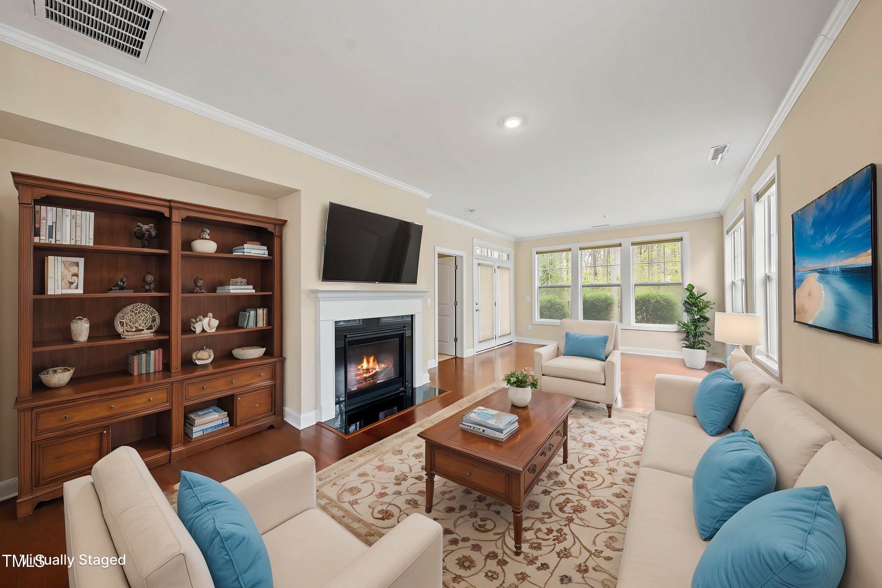 111 Wards Ridge Drive Cary, NC 27513 - Photo 16 of 46 a living room with furniture fireplace and a flat screen tv