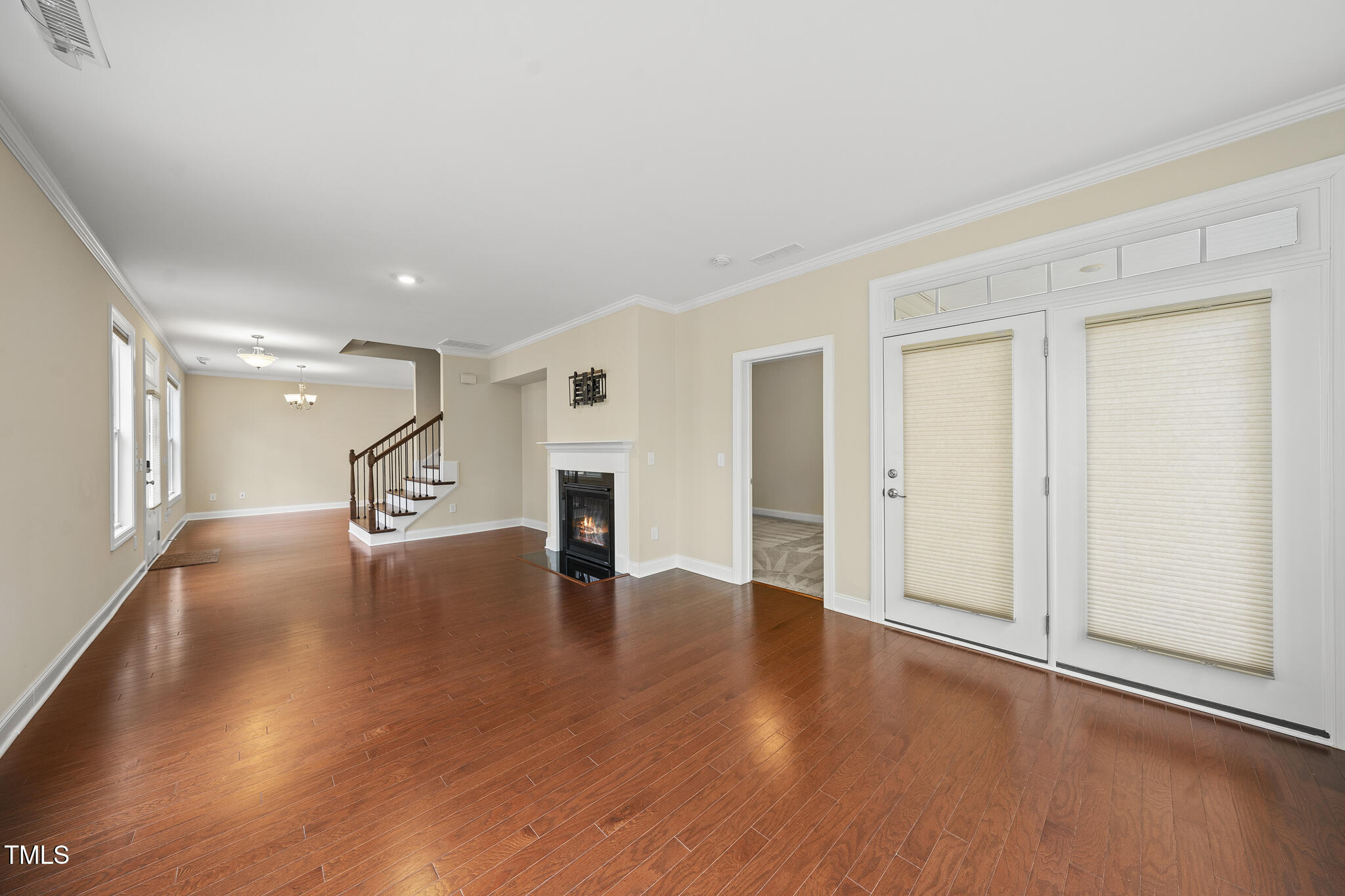 111 Wards Ridge Drive Cary, NC 27513 - Photo 18 of 46 a view of an empty room with wooden floor and a window