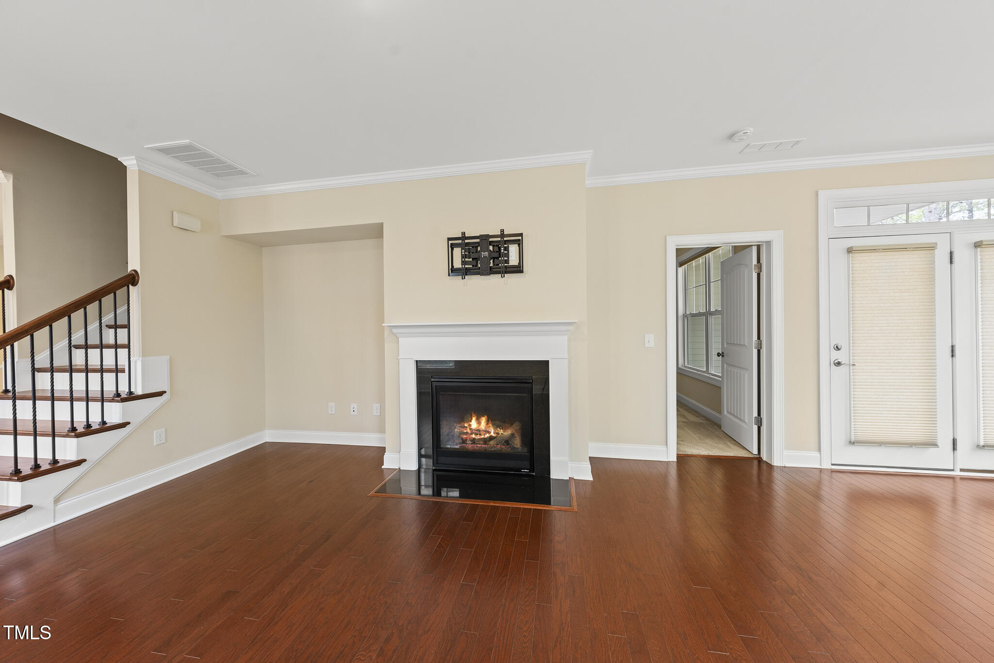 111 Wards Ridge Drive Cary, NC 27513 - Photo 20 of 46 a view of a livingroom with wooden floor and a fireplace