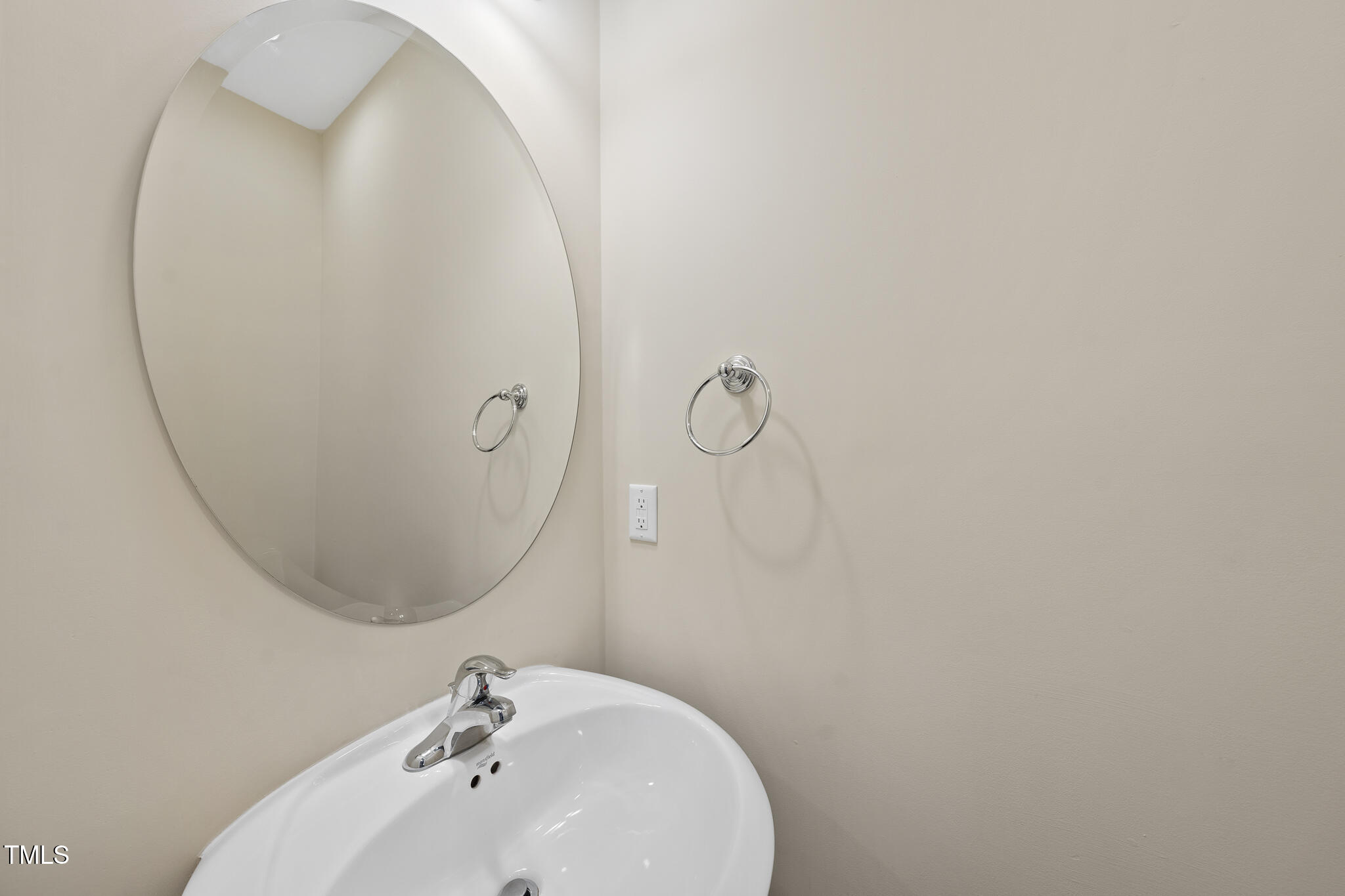 111 Wards Ridge Drive Cary, NC 27513 - Photo 21 of 46 a bathroom with a sink and mirror