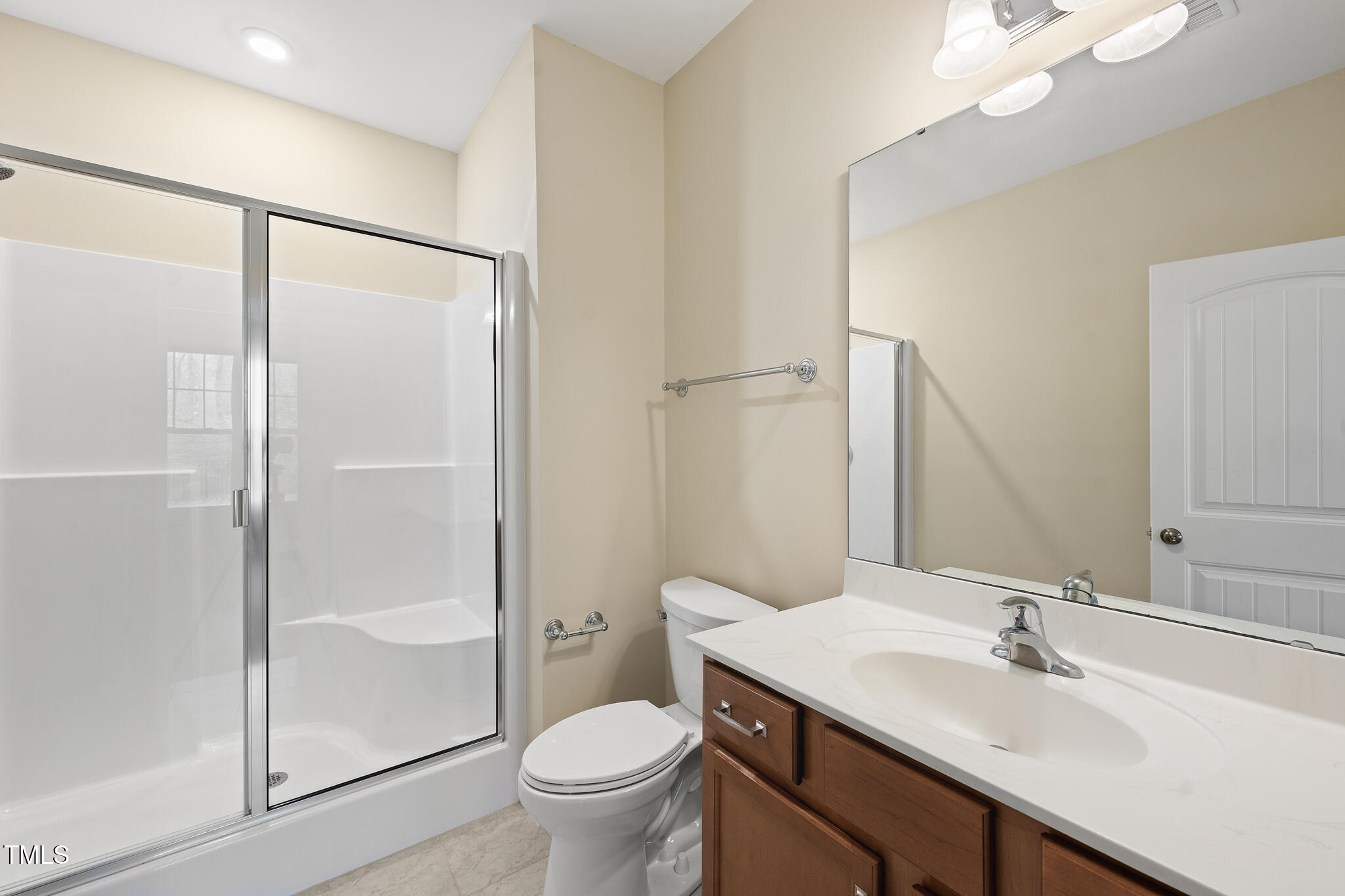 111 Wards Ridge Drive Cary, NC 27513 - Photo 25 of 46 a bathroom with a sink toilet and shower