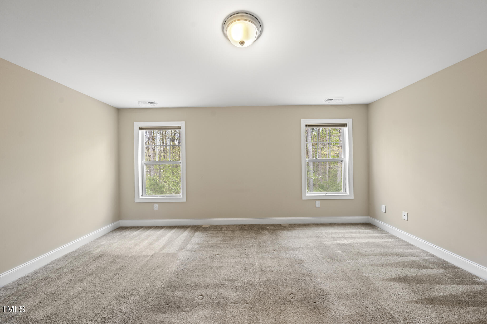 111 Wards Ridge Drive Cary, NC 27513 - Photo 27 of 46 an empty room with windows