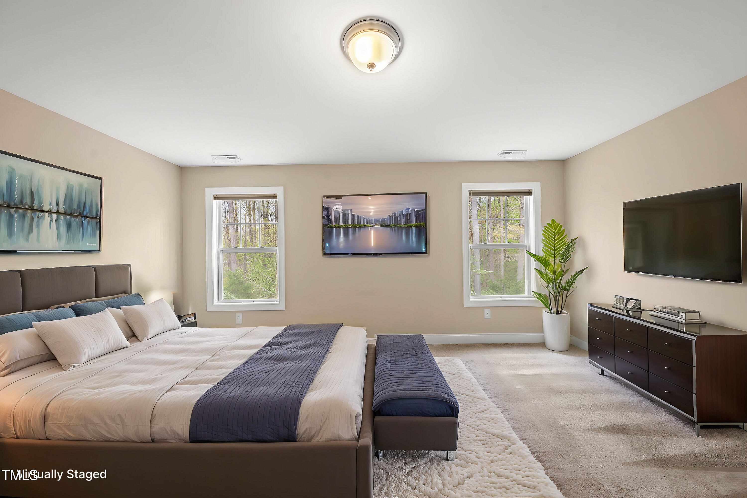 111 Wards Ridge Drive Cary, NC 27513 - Photo 28 of 46 a bedroom with a large bed and a flat screen tv