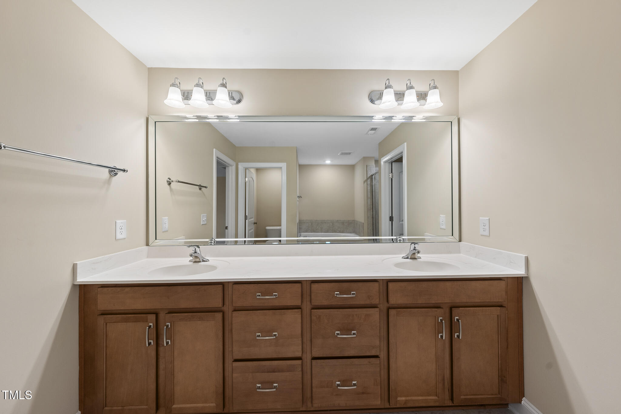 111 Wards Ridge Drive Cary, NC 27513 - Photo 31 of 46 a bathroom with a sink double vanity and a mirror