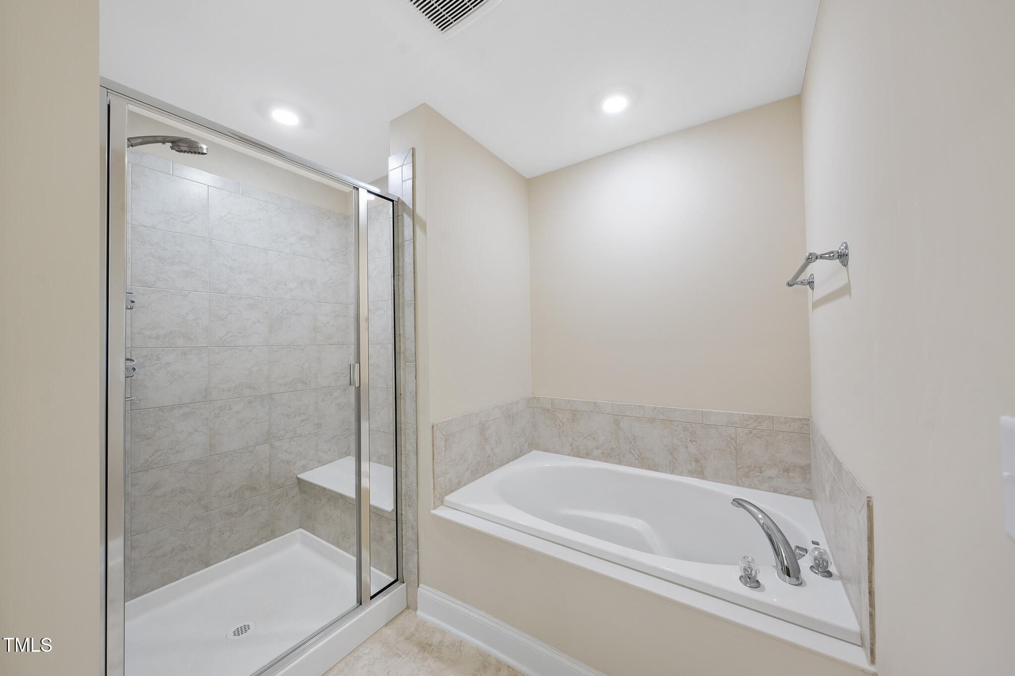 111 Wards Ridge Drive Cary, NC 27513 - Photo 32 of 46 a bathroom with a bathtub and a shower