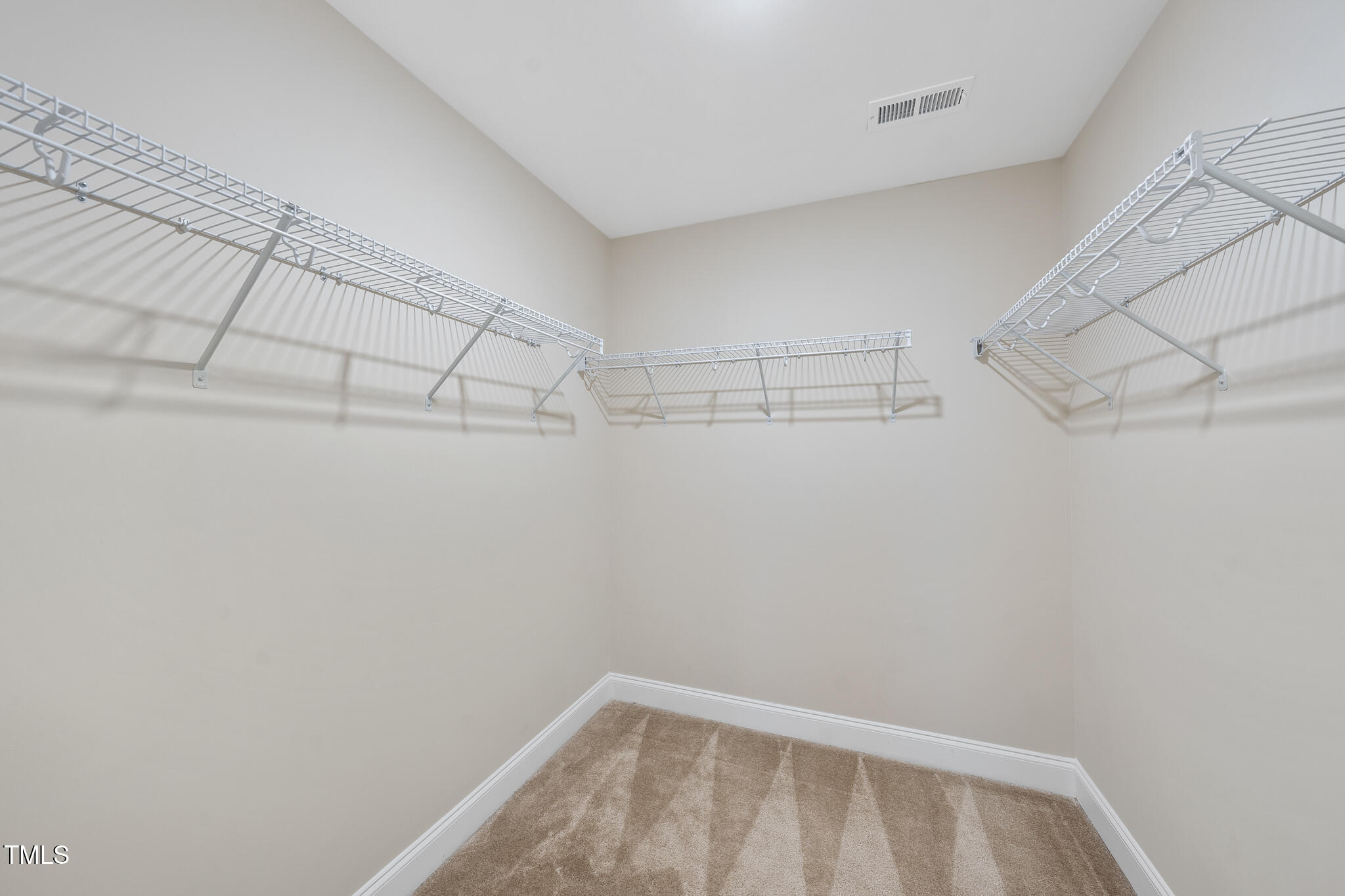 111 Wards Ridge Drive Cary, NC 27513 - Photo 33 of 46 a view of a room with racks on the wall
