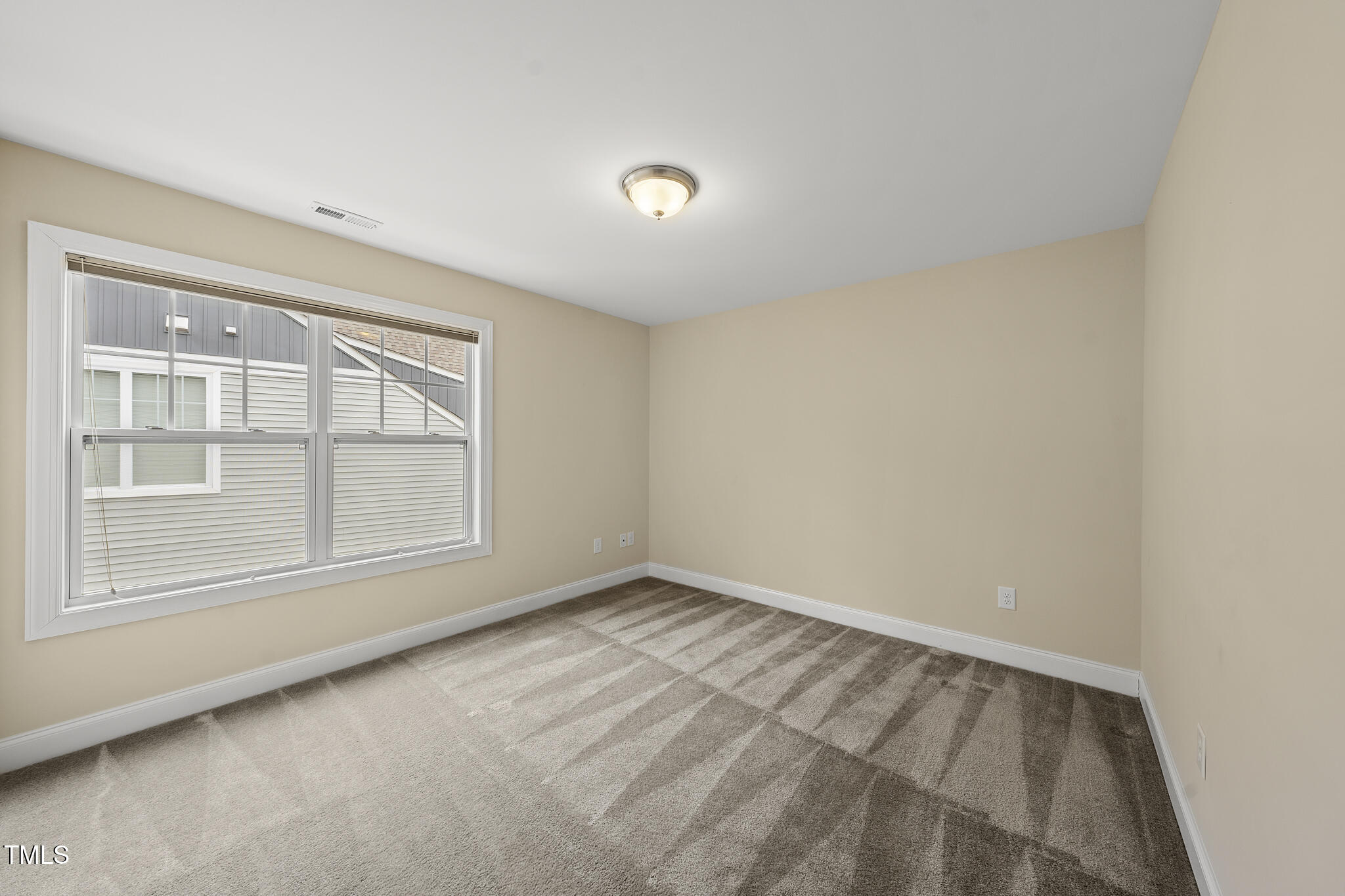 111 Wards Ridge Drive Cary, NC 27513 - Photo 34 of 46 an empty room with a window