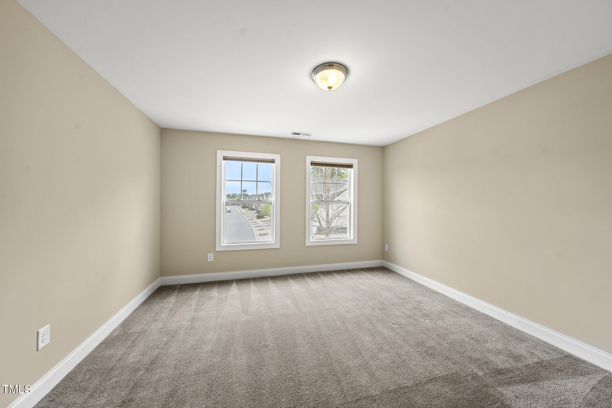 111 Wards Ridge Drive Cary, NC 27513 - Photo 36 of 46 an empty room with windows