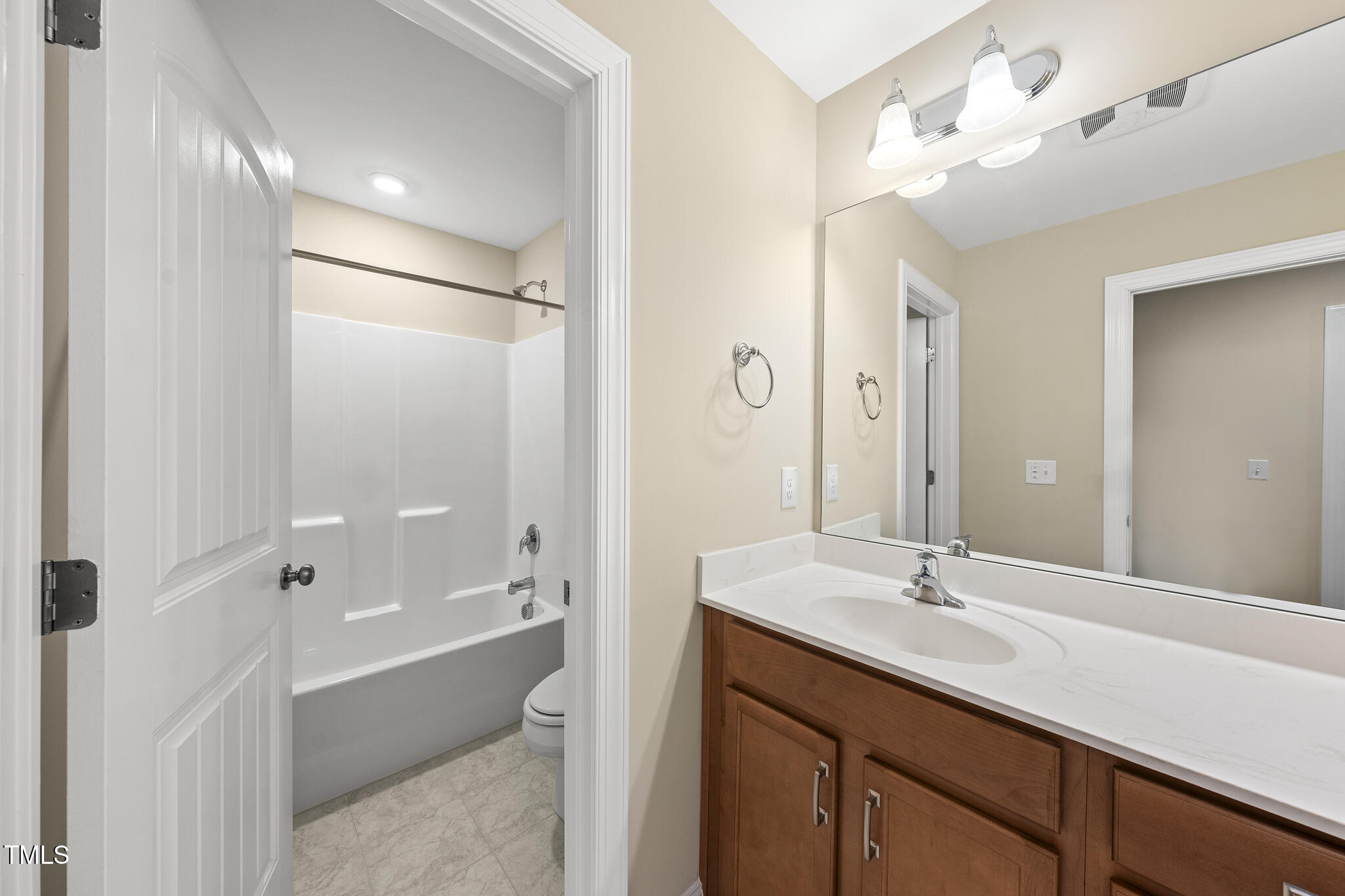 111 Wards Ridge Drive Cary, NC 27513 - Photo 39 of 46 a bathroom with a bathtub shower sink double and mirror