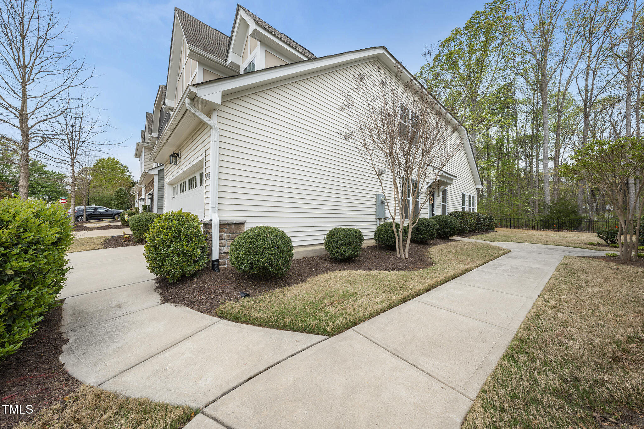 111 Wards Ridge Drive Cary, NC 27513 - Photo 5 of 46 a view of a white house with a small yard and large tree