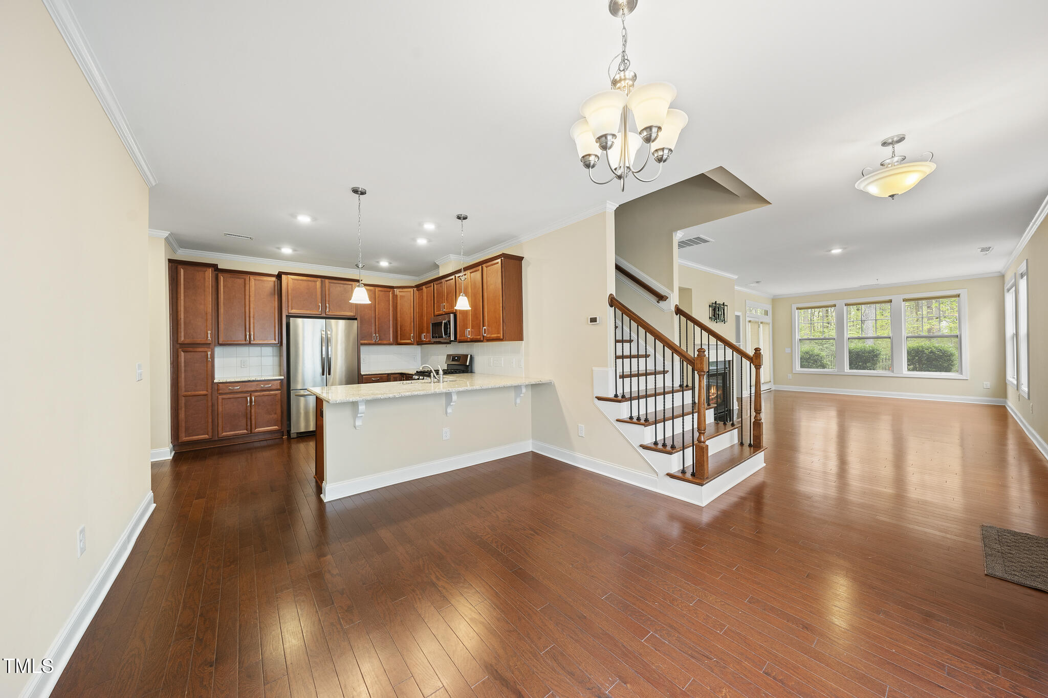 111 Wards Ridge Drive Cary, NC 27513 - Photo 6 of 46 a view of a hallway with wooden floor and staircase