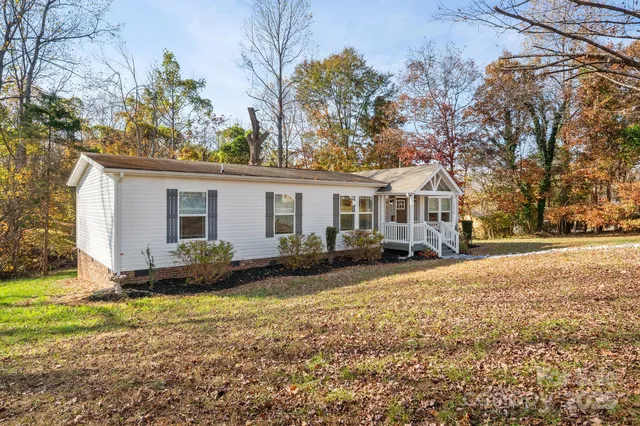 a front view of house with yard having seating