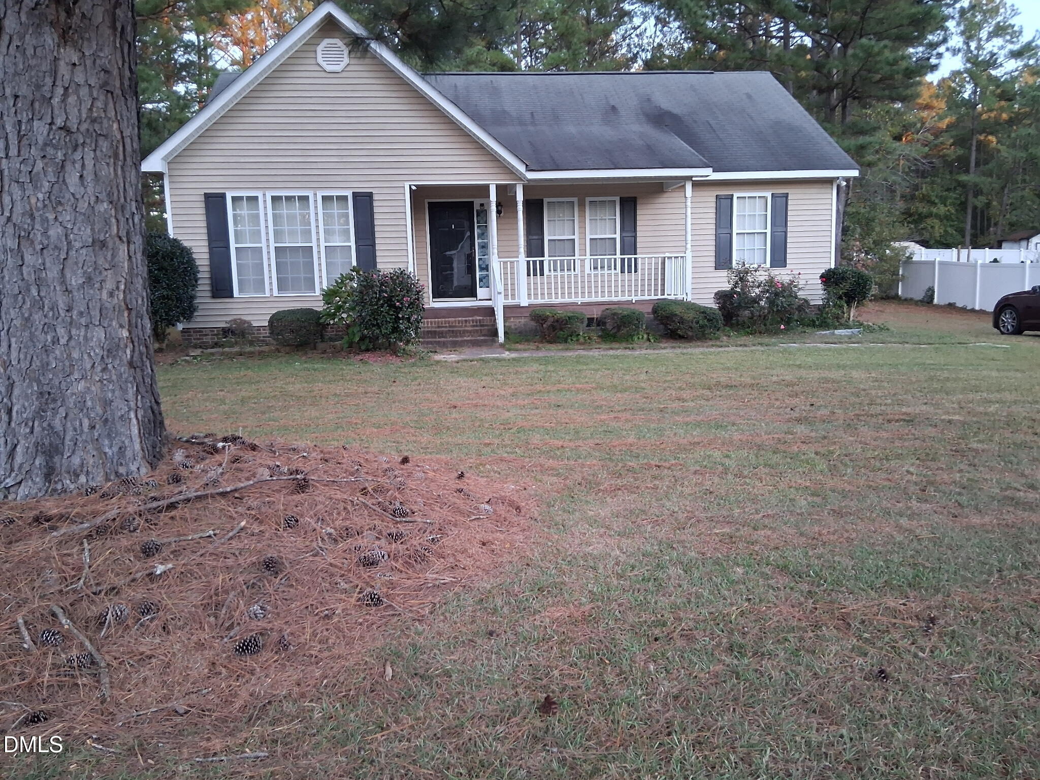 443 Tranquil Lane Willow Spring, NC 27592 - Photo 2 of 23 a front view of a house with garden