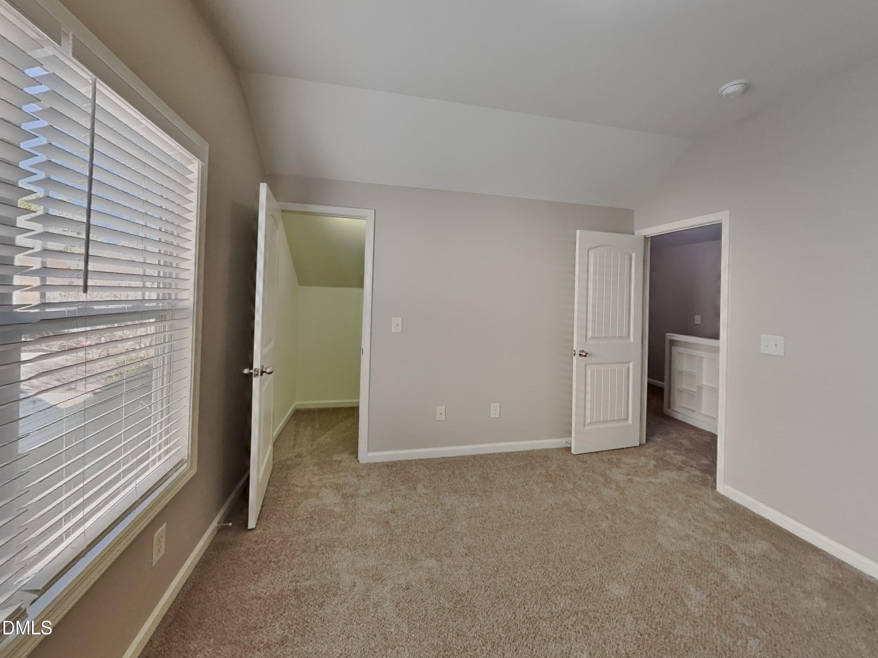 3152 Landing Falls Lane Raleigh, NC 27616 - Photo 16 of 24 a view of an empty room with closet and a window