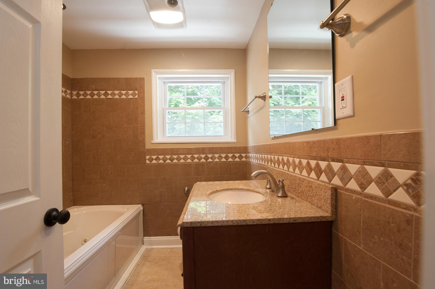 34 Eastship Road Baltimore, MD 21222 - Photo 13 of 19 a bathroom with a sink and a mirror