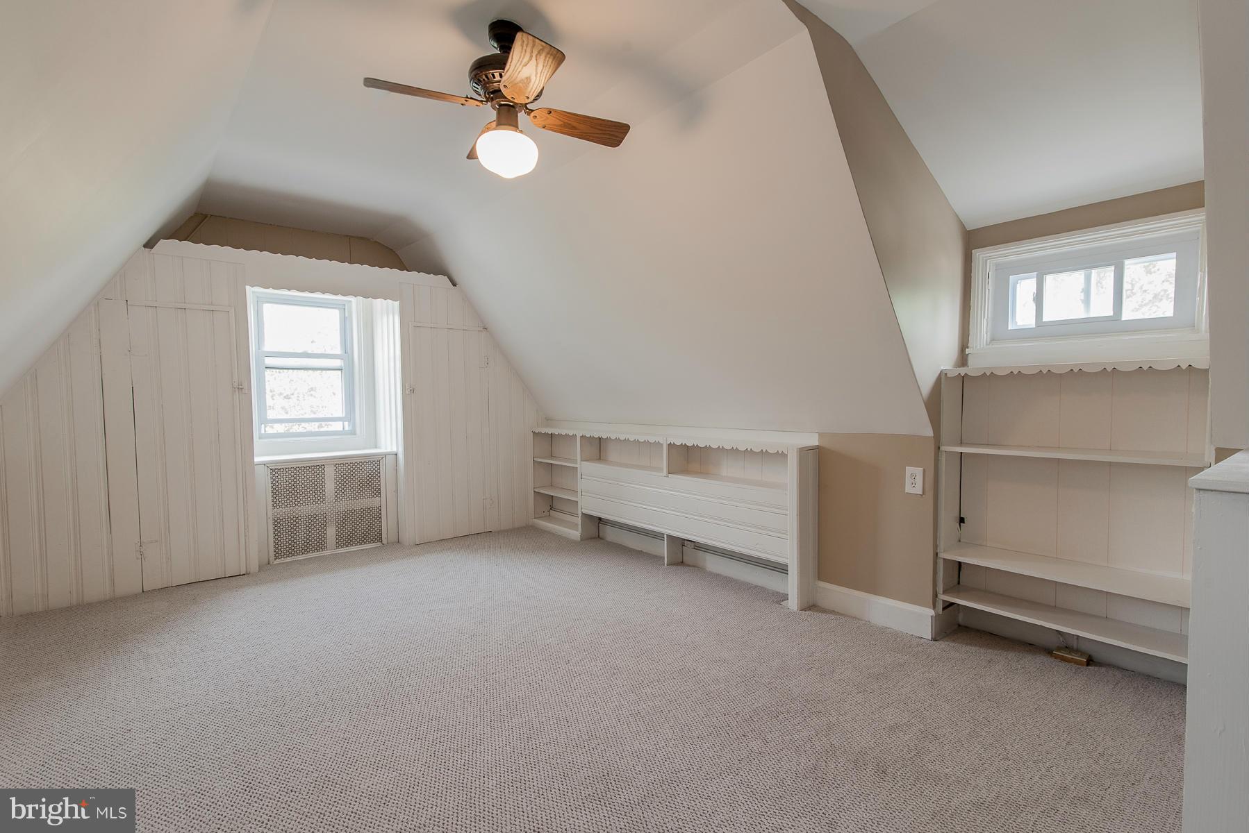 34 Eastship Road Baltimore, MD 21222 - Photo 15 of 19 an empty room with windows and ceiling fan