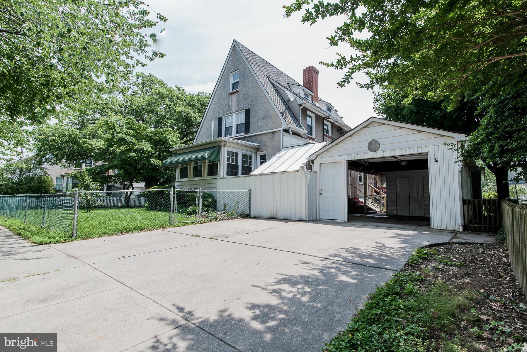 34 Eastship Road Baltimore, MD 21222 - Photo 18 of 19 a front view of a house with a garden and trees