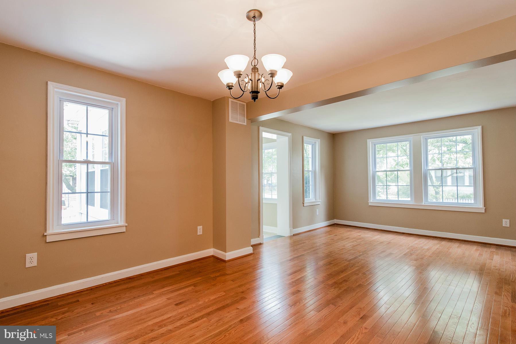 34 Eastship Road Baltimore, MD 21222 - Photo 8 of 19 a view of an empty room with a window and wooden floor