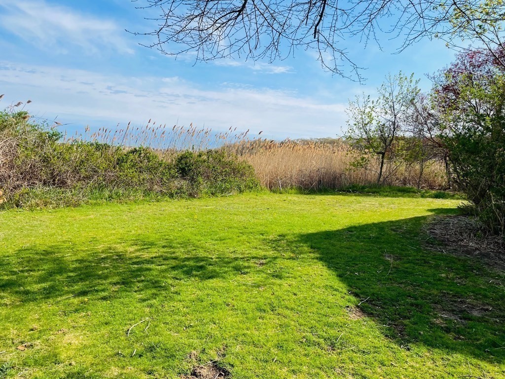 57 Marshview Drive Marshfield, MA 02050 - Photo 11 of 13 a view of a field with an ocean