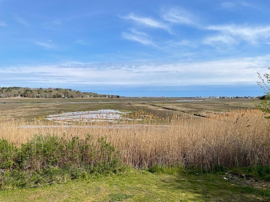 57 Marshview Drive Marshfield, MA 02050 - Photo 13 of 13 a view of a lake with a big yard