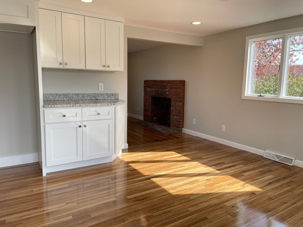 57 Marshview Drive Marshfield, MA 02050 - Photo 7 of 13 a view of kitchen with granite countertop cabinets and wooden floor