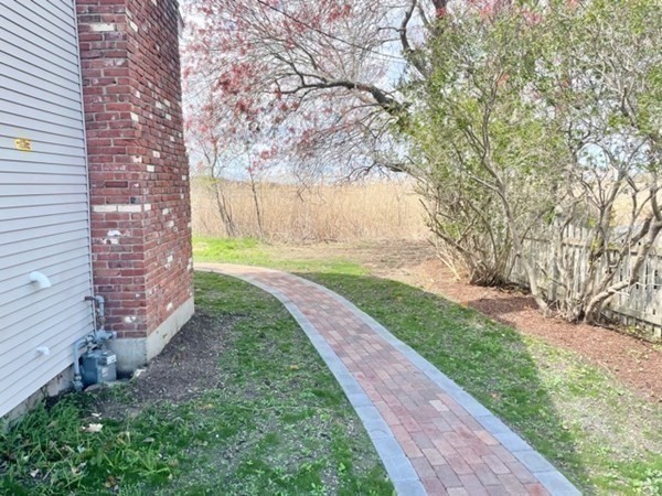 57 Marshview Drive Marshfield, MA 02050 - Photo 10 of 13 a view of a backyard with large trees